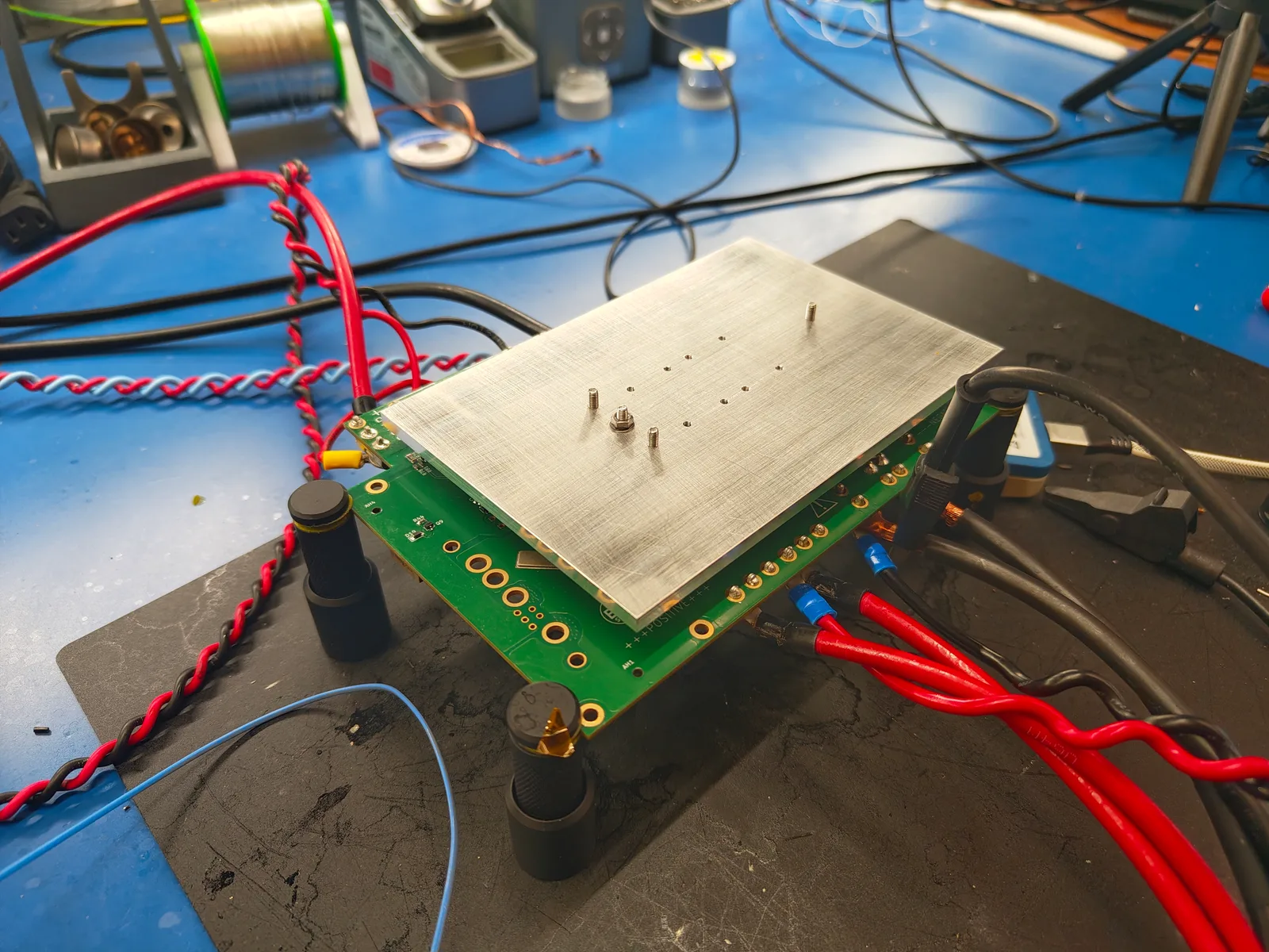 The converter under test, heatsink plate mounted, on the bench